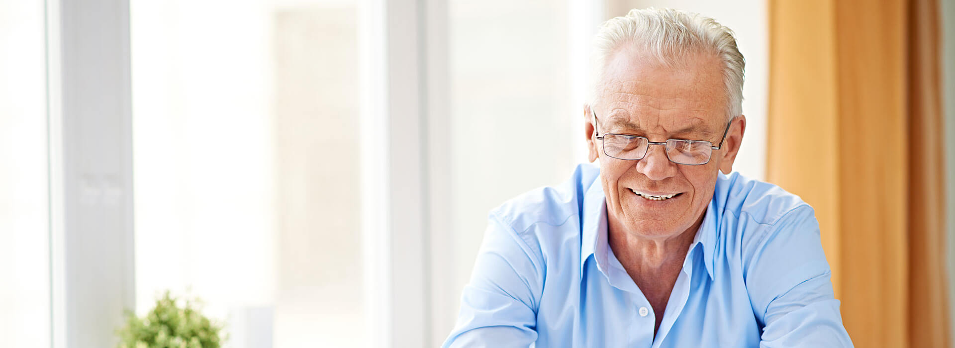 elderly man in independent living at The Delaney at Lake Waco