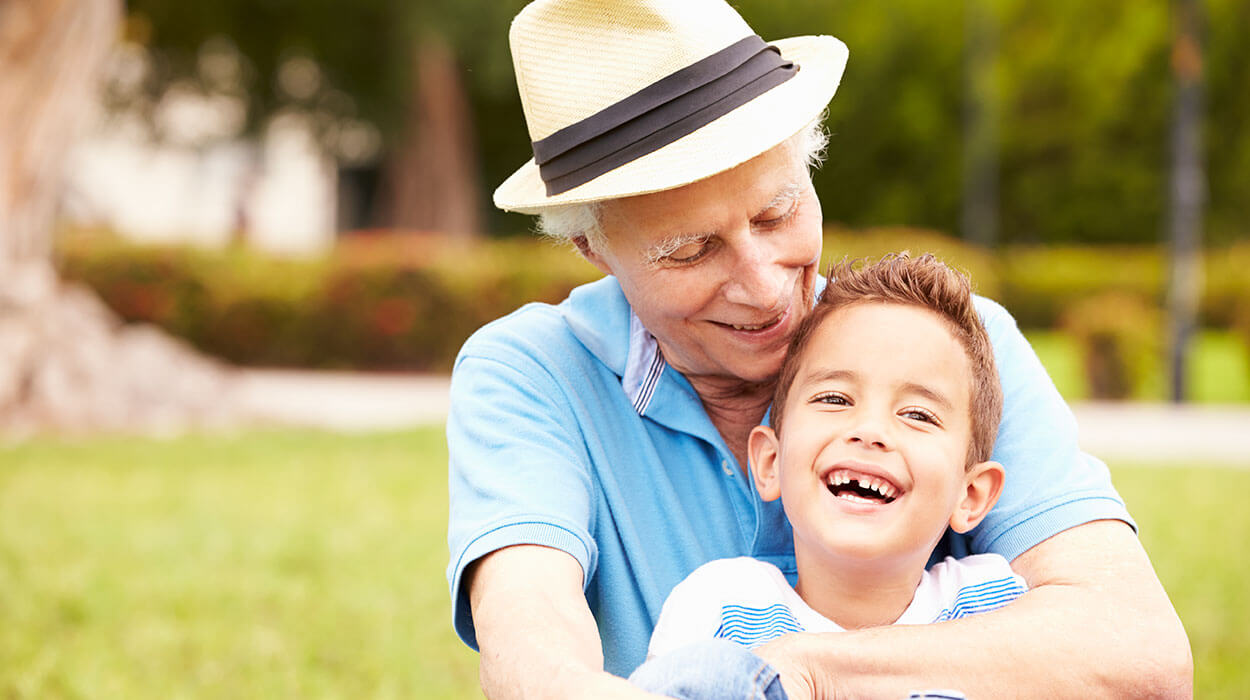 grandparent with grandchild at The Delaney at Lake Waco senior living community