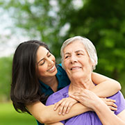 mother and daughter hugging at The Delaney at Lake Waco retirement community