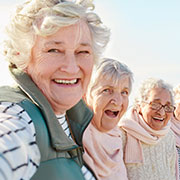 very small size three elderly women having fun at The Delaney at Lake Waco retirement community