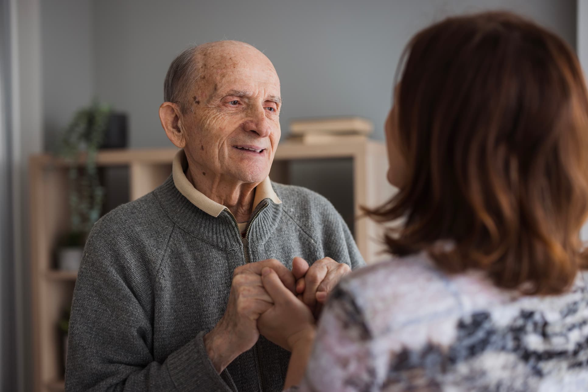 Senior man holding hands close to his heart